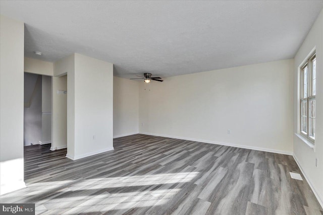 interior space featuring a textured ceiling, light hardwood / wood-style floors, and ceiling fan