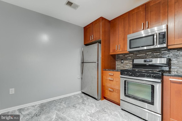 kitchen featuring backsplash and appliances with stainless steel finishes