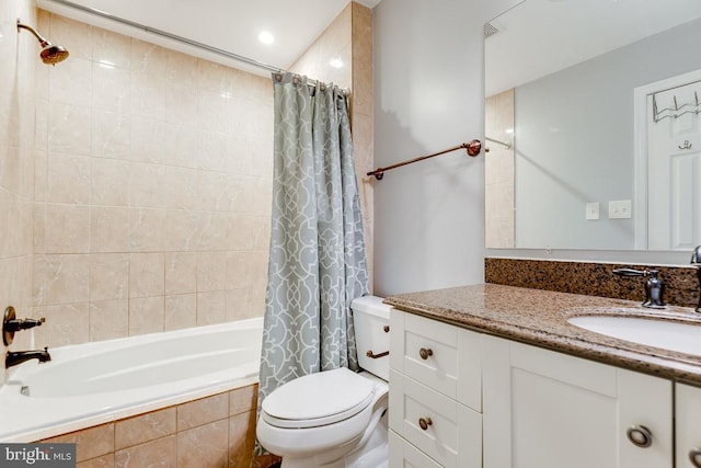 full bathroom featuring shower / bath combination with curtain, vanity, and toilet