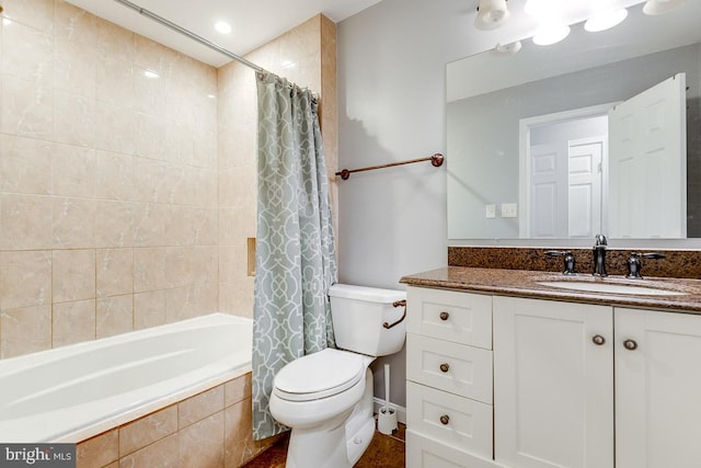 full bathroom featuring toilet, vanity, and shower / tub combo with curtain