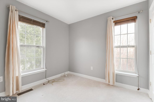 empty room with light colored carpet