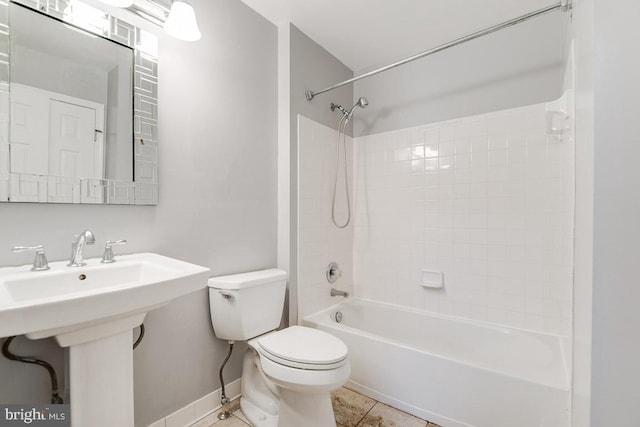 full bathroom with toilet, tile patterned flooring, shower / bath combination, and sink