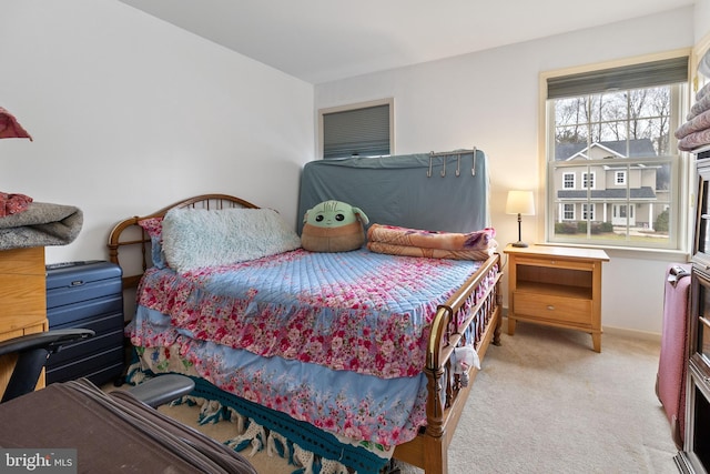 bedroom featuring light colored carpet