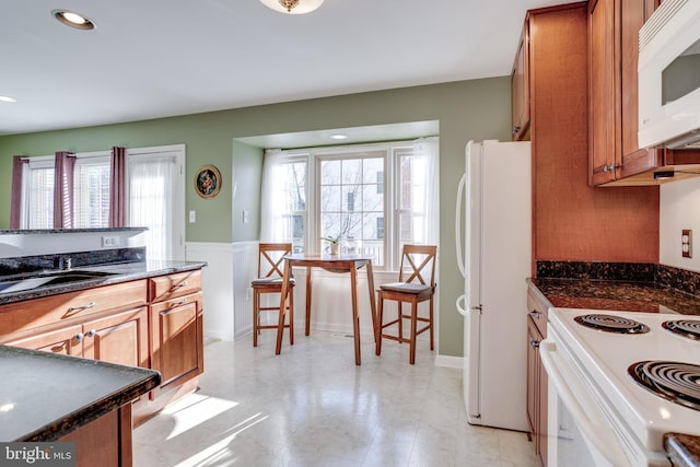 kitchen featuring sink and white appliances