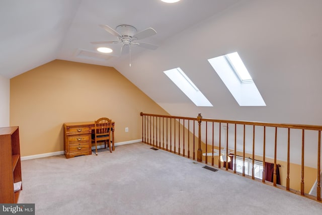 bonus room with ceiling fan, light colored carpet, and vaulted ceiling