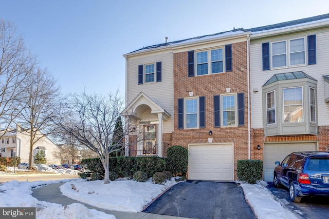 multi unit property featuring a garage