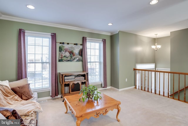 carpeted living room featuring a wealth of natural light, crown molding, and a notable chandelier