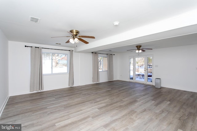 spare room featuring light hardwood / wood-style floors and ceiling fan