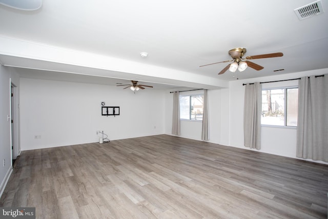 spare room with ceiling fan and light hardwood / wood-style flooring