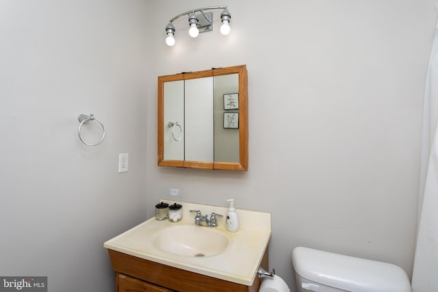 bathroom with vanity and toilet