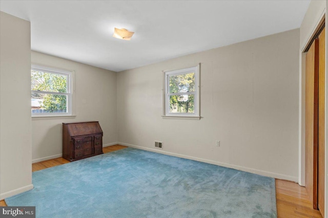 spare room with light wood-type flooring