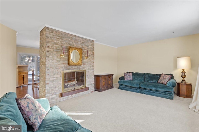 living room with carpet, ornamental molding, and a fireplace