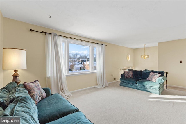 carpeted living room featuring a notable chandelier