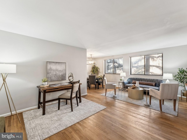 office space with a chandelier and hardwood / wood-style floors