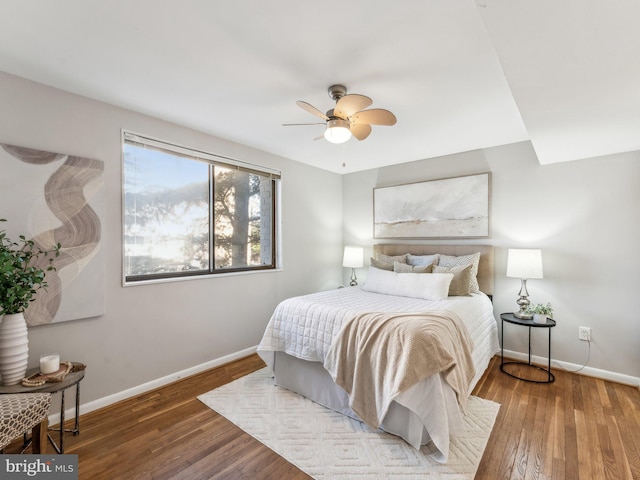 bedroom featuring ceiling fan and hardwood / wood-style flooring