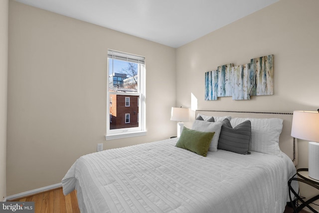 bedroom with wood-type flooring