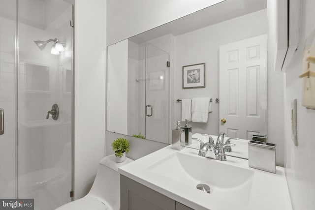 bathroom featuring walk in shower and vanity