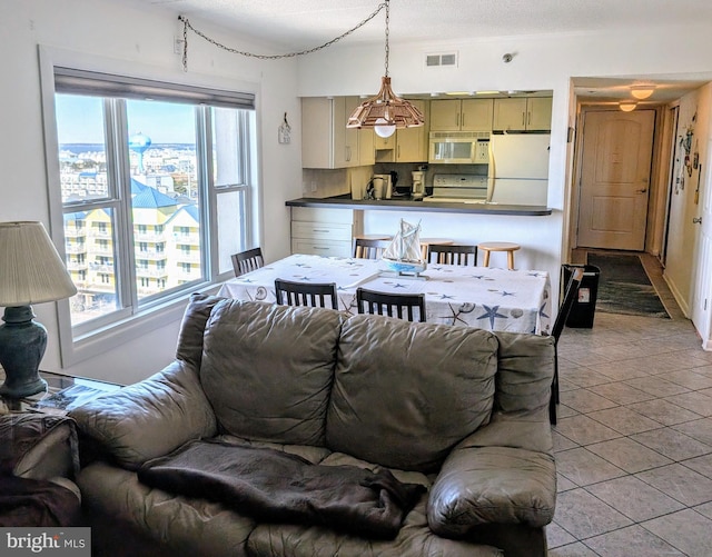 living room featuring light tile patterned flooring