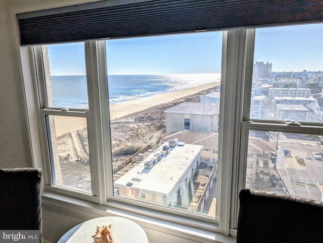 interior details with a water view and a view of the beach