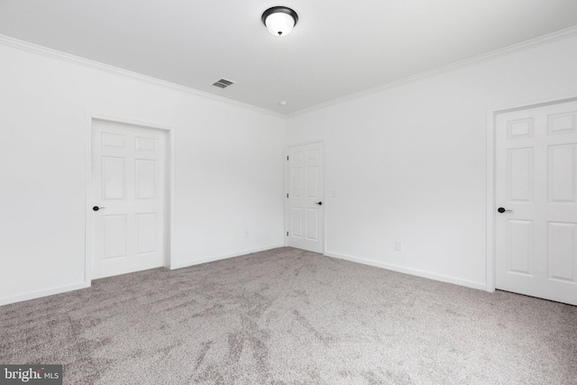 carpeted spare room featuring ornamental molding