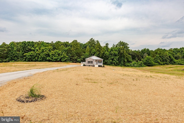 view of yard with a rural view