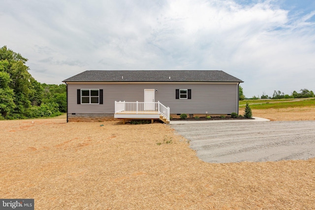 view of front of house featuring a wooden deck