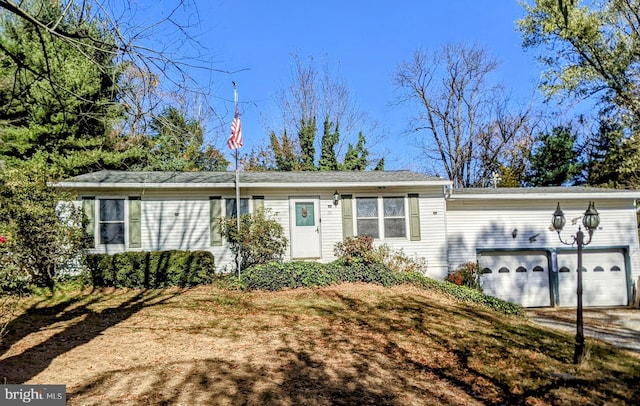 single story home featuring a garage