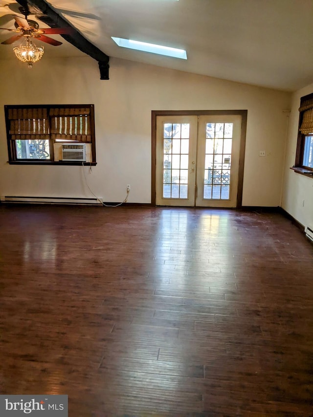 unfurnished living room with ceiling fan, baseboard heating, dark hardwood / wood-style flooring, french doors, and lofted ceiling with skylight