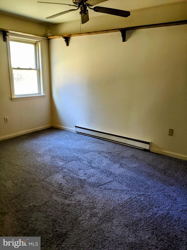 carpeted spare room featuring baseboard heating and ceiling fan