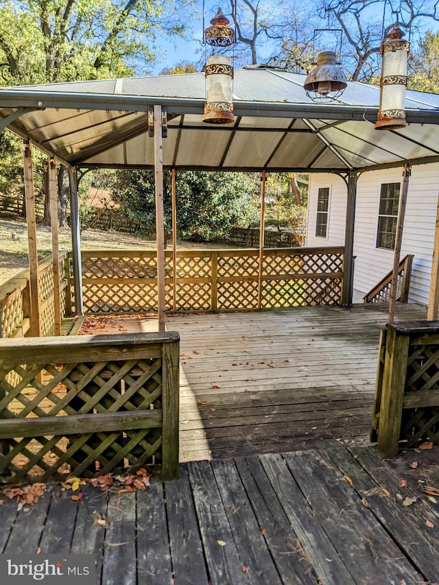 wooden deck featuring a gazebo