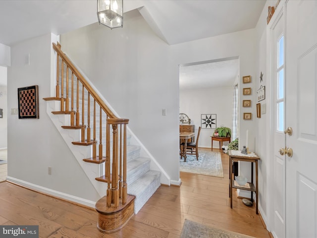 stairway featuring hardwood / wood-style floors