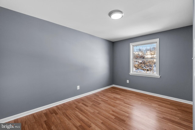 unfurnished room featuring hardwood / wood-style floors