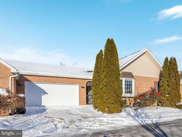 single story home featuring a garage