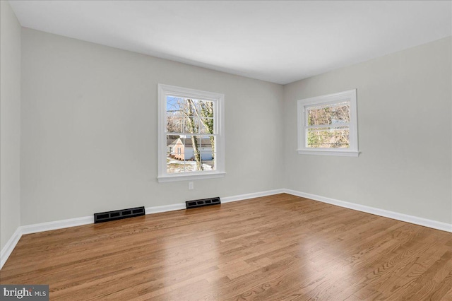 empty room featuring hardwood / wood-style floors