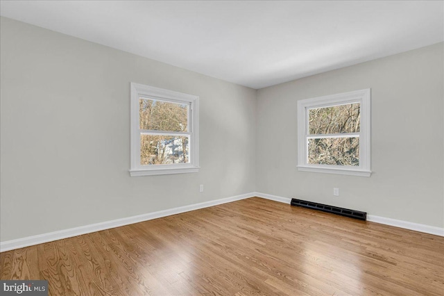 spare room with light wood-type flooring