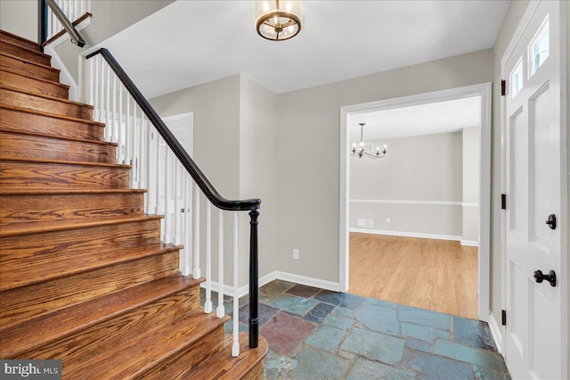 entryway featuring a notable chandelier