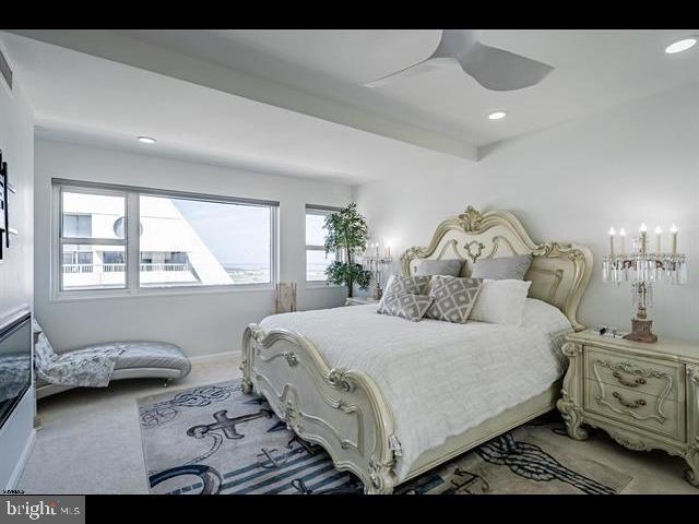 bedroom featuring ceiling fan and carpet floors