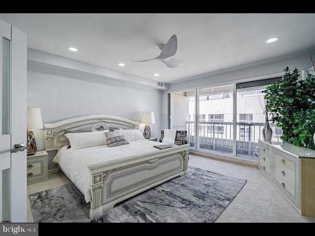 bedroom with light carpet, access to outside, and ceiling fan