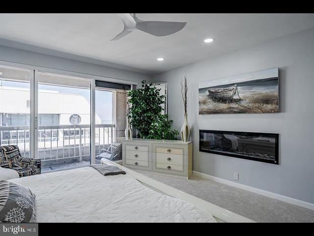 bedroom with ceiling fan, carpet flooring, and access to outside