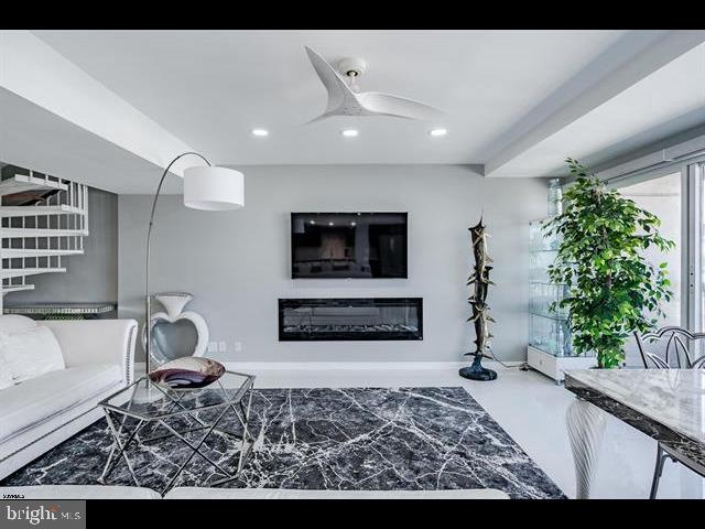 living room with ceiling fan