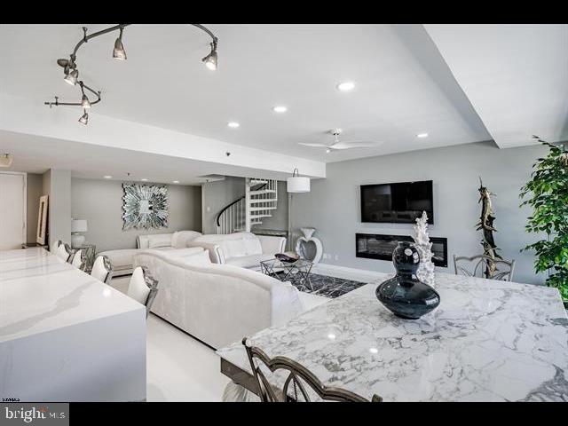 living room featuring rail lighting and ceiling fan