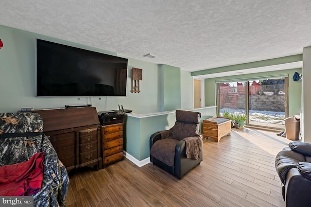 living room featuring a textured ceiling