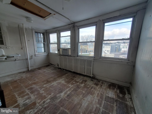 interior space featuring cooling unit and radiator heating unit