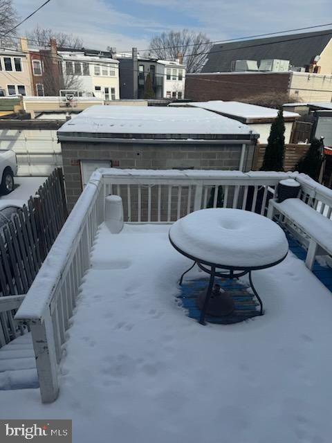 view of snow covered deck