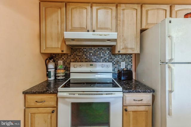 kitchen featuring tasteful backsplash, white appliances, dark stone counters, and light brown cabinetry