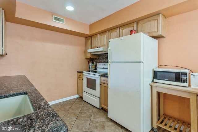 kitchen with light tile patterned flooring, light brown cabinetry, sink, tasteful backsplash, and white appliances