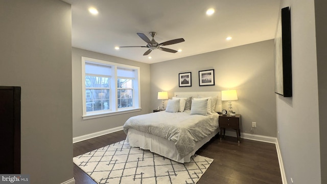 bedroom featuring ceiling fan and dark wood-type flooring