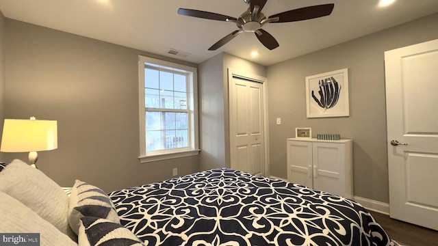 bedroom with ceiling fan, a closet, and hardwood / wood-style floors