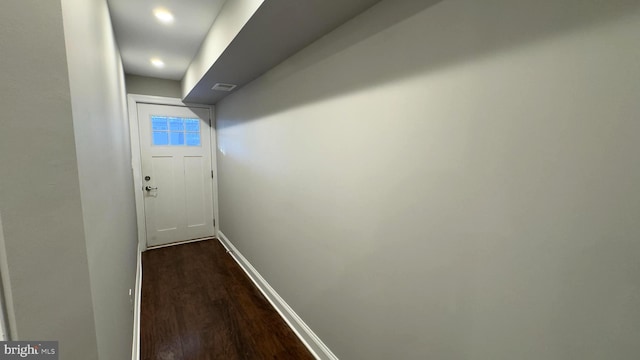 hallway featuring dark hardwood / wood-style flooring