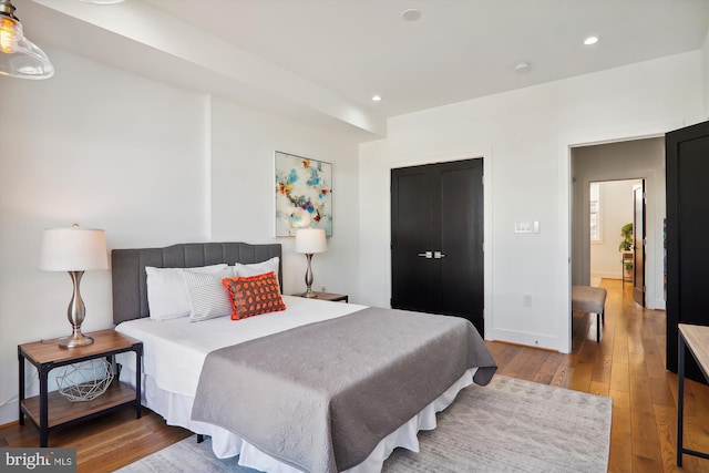 bedroom with hardwood / wood-style floors